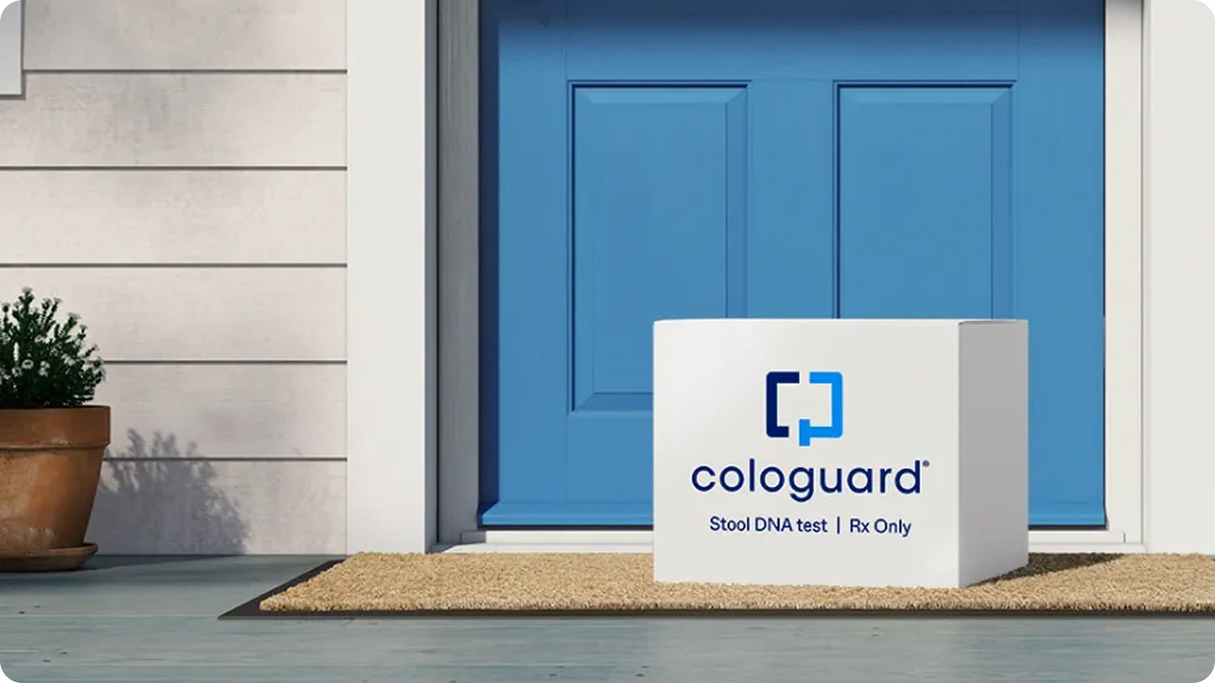 A just-delivered Cologuard box sits in front of a doorstep.