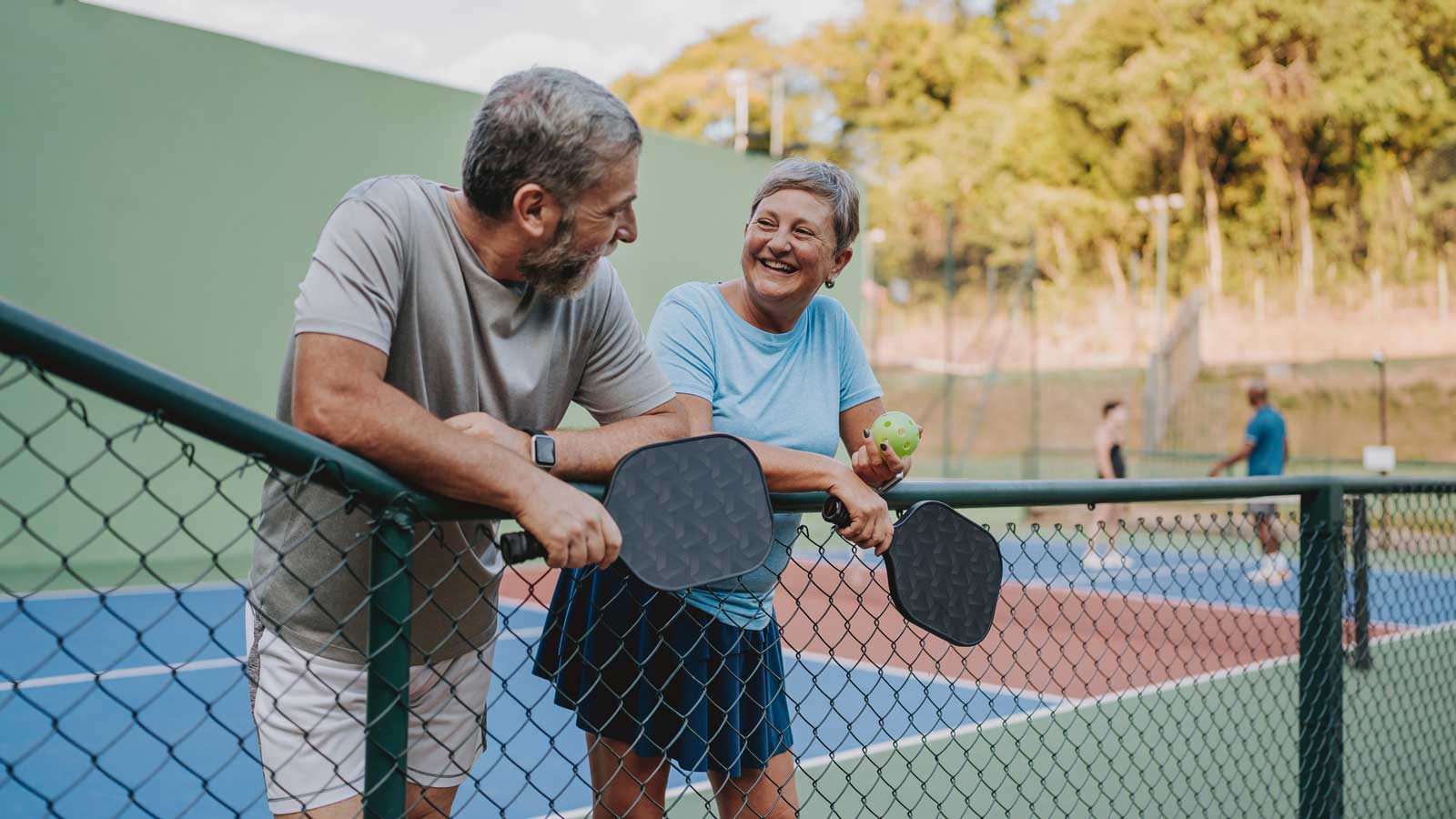 Couple enjoying outdoor activity after completing noninvasive colon cancer screening.
