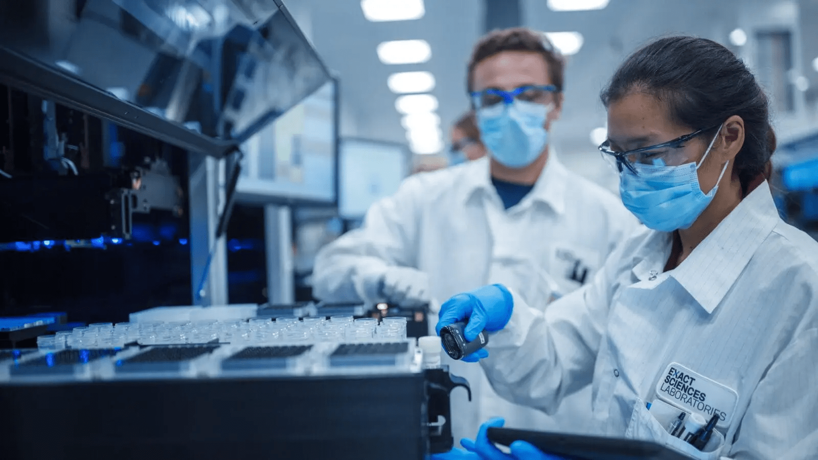 A couple of scientists examining test samples in a lab.