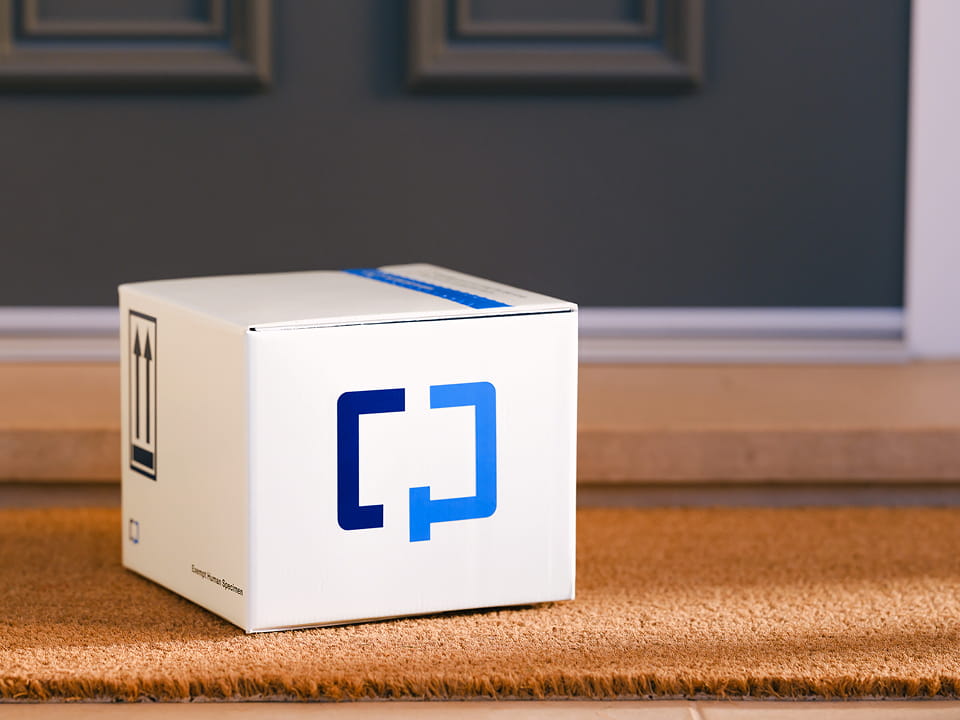  A Cologuard Plus box by a front door.